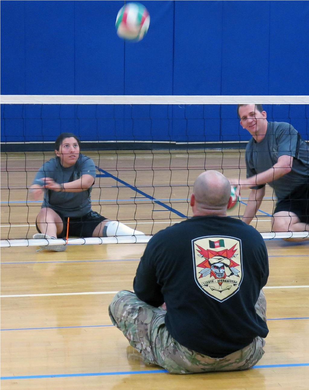 Army Sgt. Lauren Montoya, left, whose left leg was amputated below the knee, serves during a game of seated volleyball Wednesday in the MacDill Air Force Base gym. The game was practice for the Defense Department’s Warrior Games in June. HOWARD ALTMAN/STAFF Commandos at MacDill AFB gear up for the annual Warrior Games by Howard Altman, The Tampa Tribune 3/6/2016